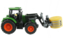 tractor met baal in klem
